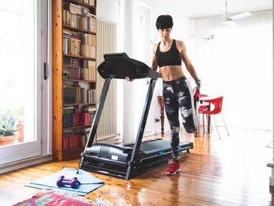 Woman getting fit and doing home training in the living room.