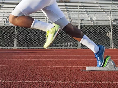 man starting running on running track