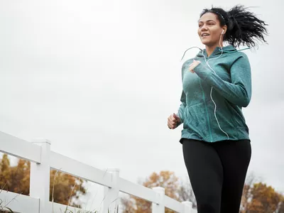 Shot of an attractive young woman going for a run in nature