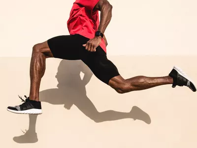 Black Athlete Sprinting On The Street.