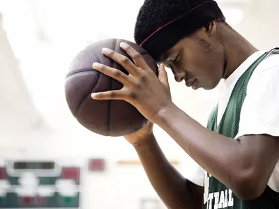 A baskeball player practicing visualization.