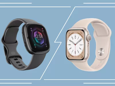 A Fitbit and Apple Watch atop a decorative blue background