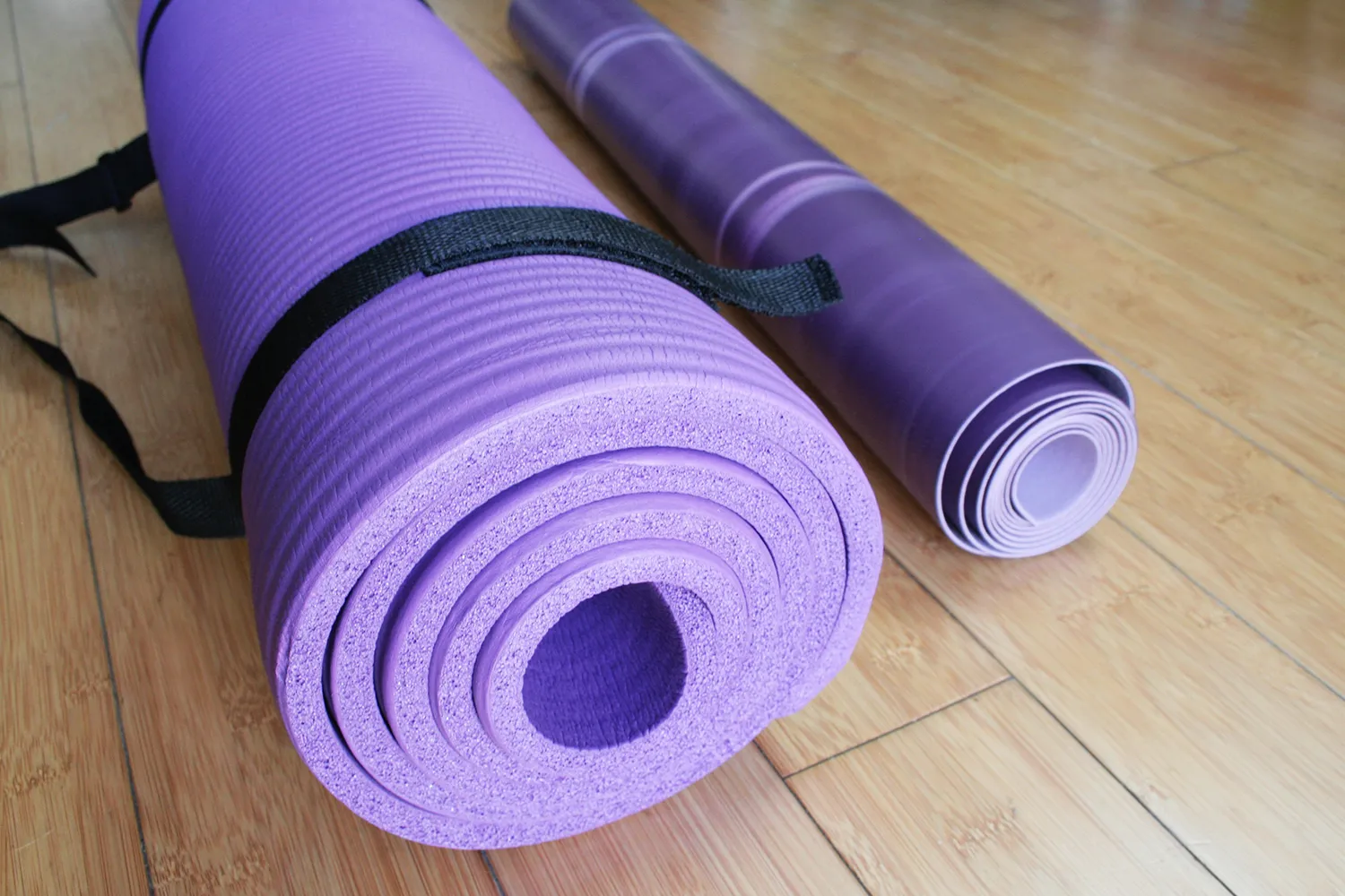 BalanceFrom GoYoga All-Purpose Yoga Mat placed on wooden floor