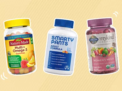 Assortment of gummy vitamins outlined in white and displayed on a two-tone beige patterned background