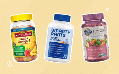 Assortment of gummy vitamins outlined in white and displayed on a two-tone beige patterned background