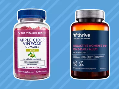 Vitamin bottles from the best places to buy vitamins on blue striped background