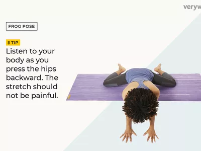 woman on a yoga mat practicing frog pose