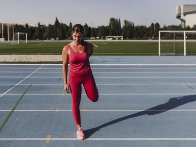 Woman stretching on a track