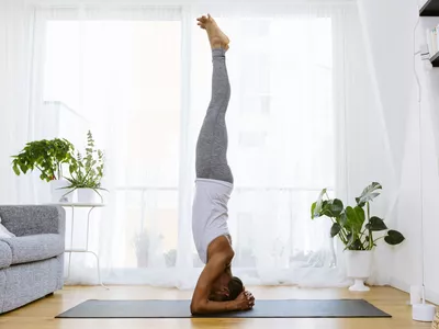 person doing a yoga headstand