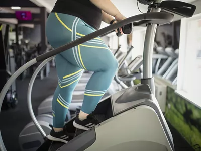 woman working out on stairmaster stair-climber machine