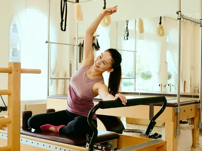 Smiling female Pilates studio owner