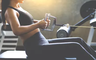 woman doing seated cable row