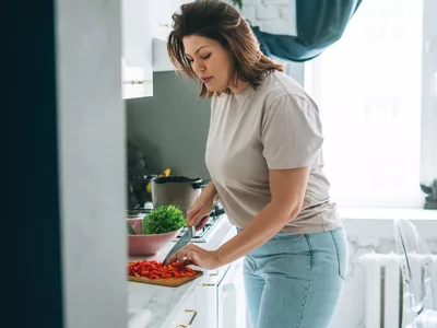 Woman making dinner in the kitchen