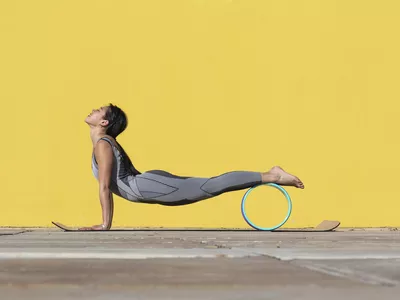 woman using yoga wheel