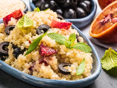 Vegan salad with quinoa, red orange and black olives