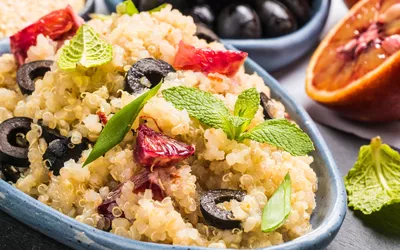 Vegan salad with quinoa, red orange and black olives