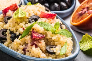 Vegan salad with quinoa, red orange and black olives