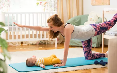 Woman exercising with her baby