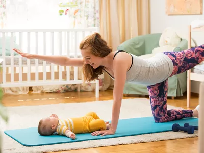 Woman exercising with her baby