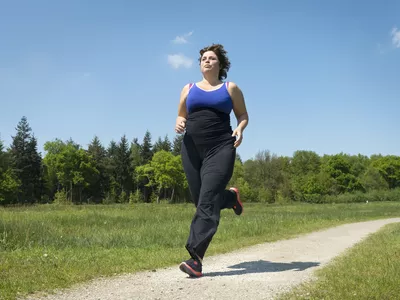Woman running on rural road