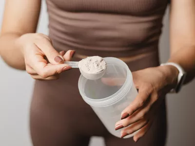 woman mixing protein powder