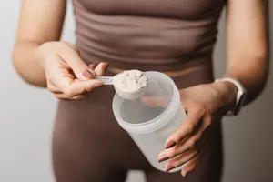 woman mixing protein powder