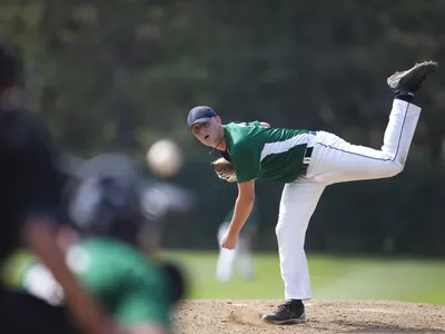 Pitcher finishes his windup and delivers a pitch to homeplate