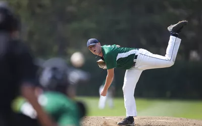 Pitcher finishes his windup and delivers a pitch to homeplate