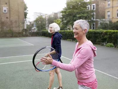 Older women playing tennis