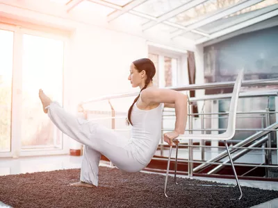 woman doing chair yoga