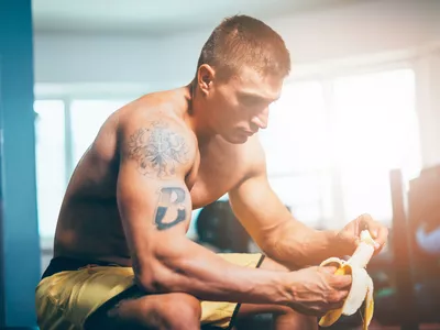 Eating banana during training in gym