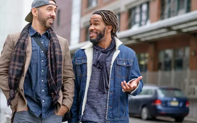 Smiley men walking down street