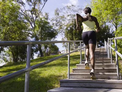 woman running up stairs