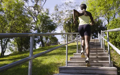 woman running up stairs