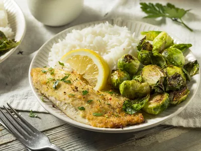 Plate of fish, Brussels sprouts, and white rice