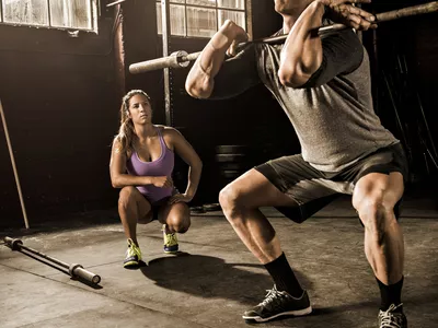 Man doing a front squat with a barbell
