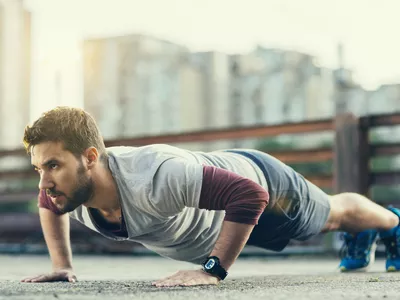 Man doing pushups outside