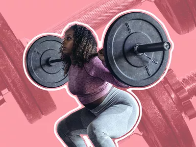 Woman lifting heavy weights