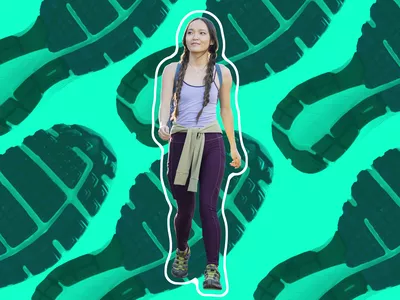 women with braids in her hair taking a walk