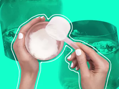 scooping collagen powder from a tub