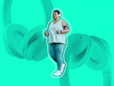 woman walking while wearing headphone and smartwatch