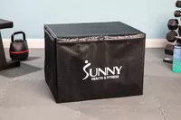 Sunny Health & Fitness High-Capacity Wooden Plyo Box on floor near fitness equipment