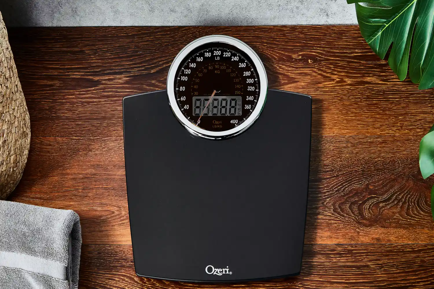 Ozeri Rev 400 lbs Bathroom Scale displayed on wooden floor