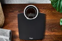 Ozeri Rev 400 lbs Bathroom Scale displayed on wooden floor