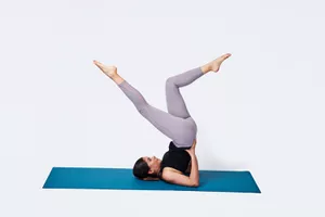 woman doing pilates bicycle