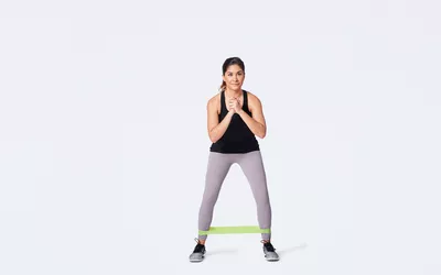 woman doing lateral band walking exercise