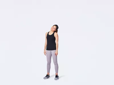woman doing a neck and shoulder stretch