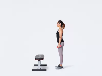 woman preparing to do a weighted step up