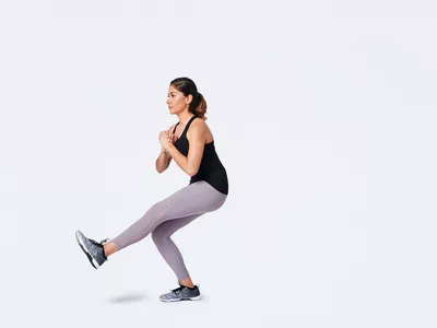 woman doing single leg squat