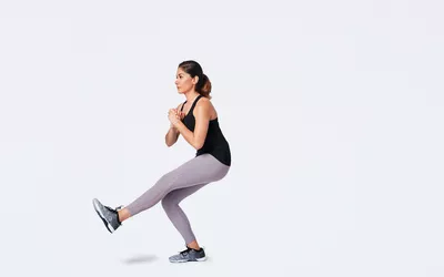 woman doing single leg squat